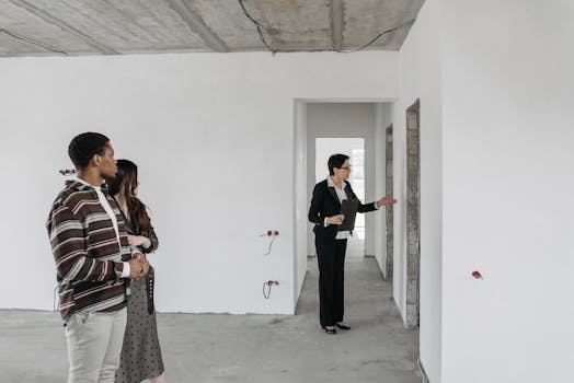 Couple and Real Estate Agent Exploring House